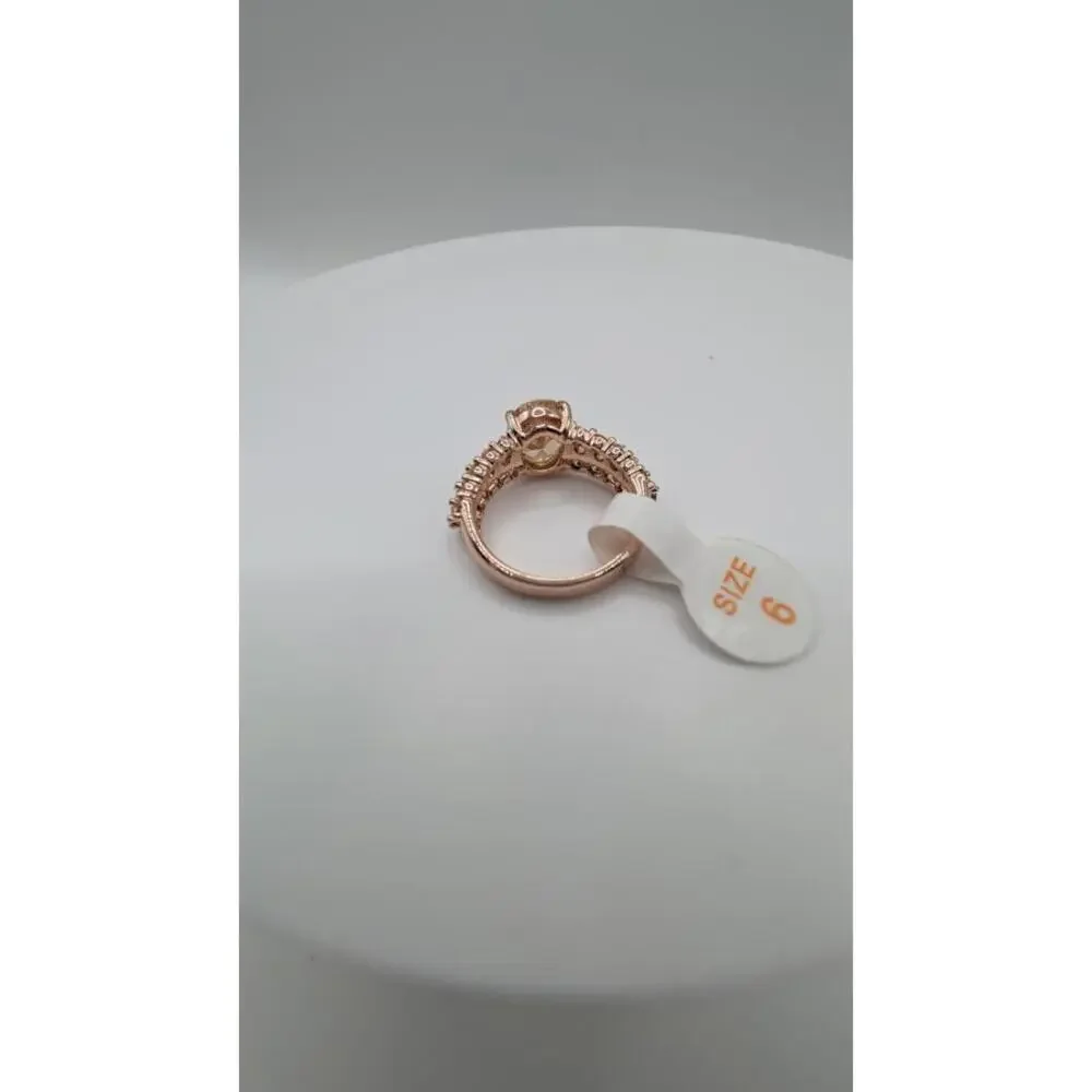 Rose Gold Tone Ring with Central Gem and Accent Stones Size 6